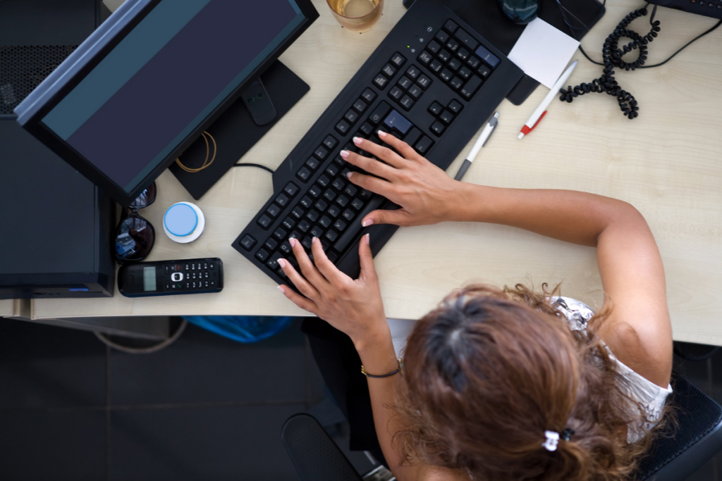 legal secretary typing on computer